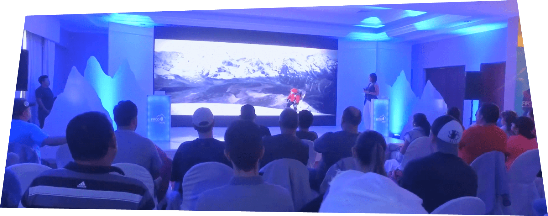 Andrea Cardona speaking on stage